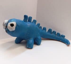 cute monster sculpture in clay turquoise