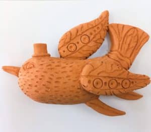 clay bird relief sculpture